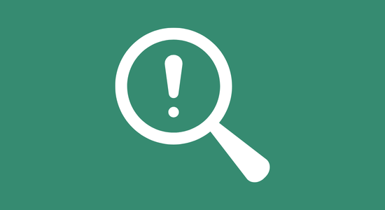 A magnifying glass with an exclamation mark in it.